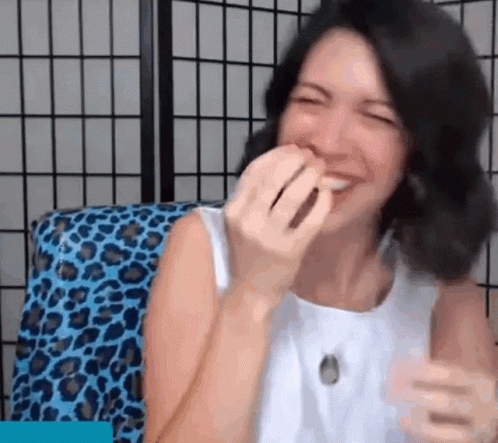 GIF of podcast host laughing and crying uncontrollably